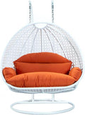 LeisureMod 2 Person Wicker Egg Chair Outdoor Indoor Bedroom Patio Hanging Lounge Swing Hammock Chairs with White Stand and UV Resistant Cushions (Orange)
