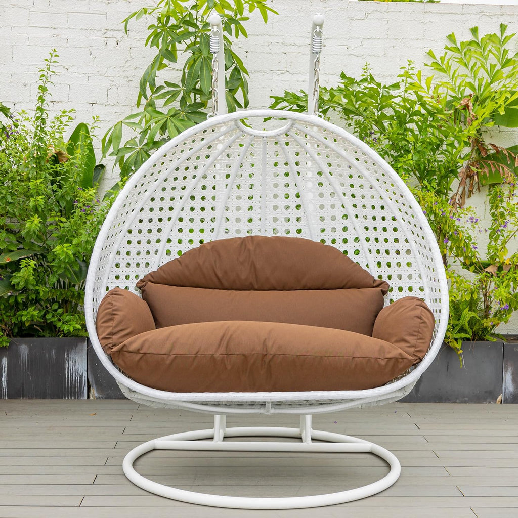 LeisureMod 2 Person Hanging Egg Chair, Indoor Outdoor Patio Lounge Swing with White Stand & UV-Resistant Cushions, Hammock Chair for Bedroom & Garden, Brown
