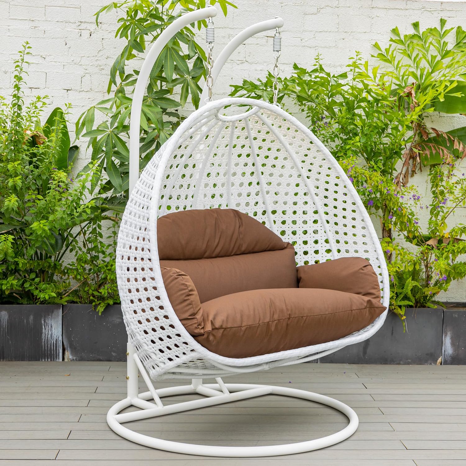 LeisureMod 2 Person Hanging Egg Chair, Indoor Outdoor Patio Lounge Swing with White Stand & UV-Resistant Cushions, Hammock Chair for Bedroom & Garden, Brown